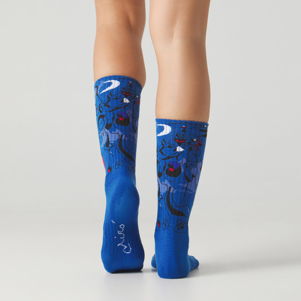 Athletic Miro Figures At Night